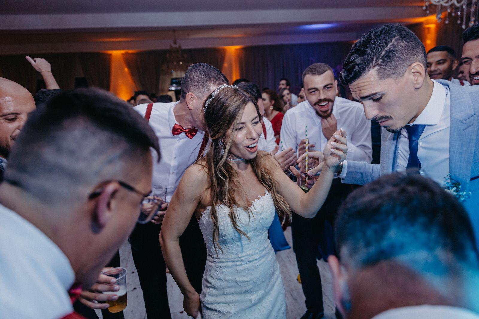 Wedding guests celebrating on the dance floor